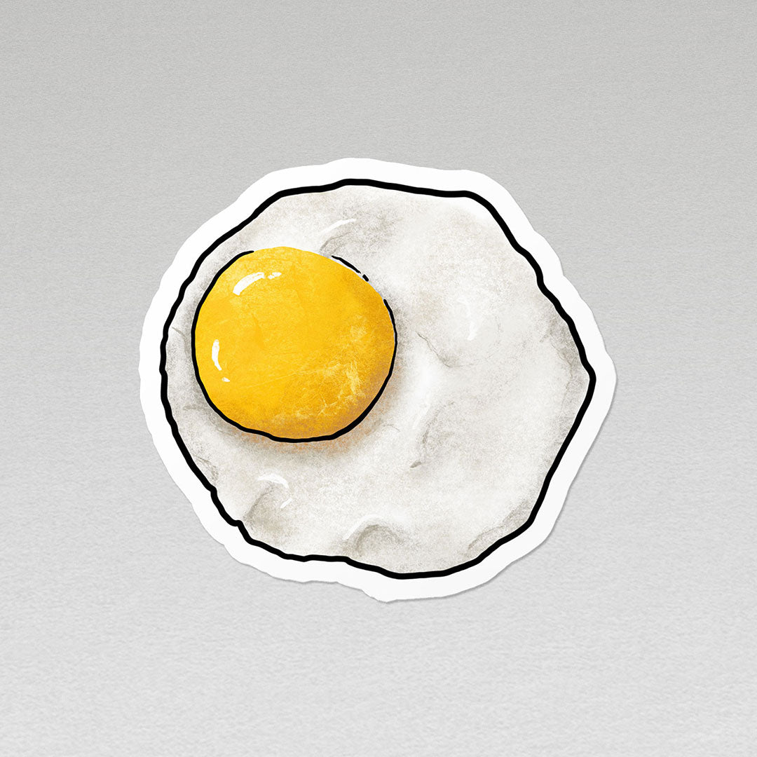 image of a fried egg vinyl sticker with white border